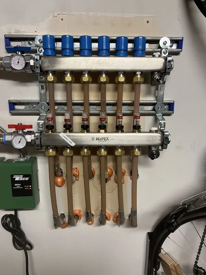 Plumber performing Water Heater Repair at a residential property in Holland